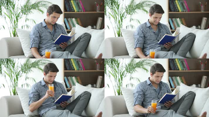 男子坐在沙发上看书喝橙汁