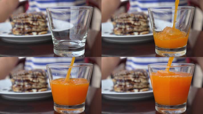 玻璃杯中倒入新鲜的橙汁