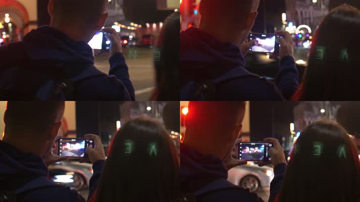 4k实拍夜间情侣用手机拍摄街景