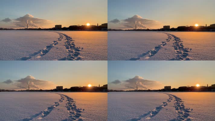 夕阳雪地的脚印