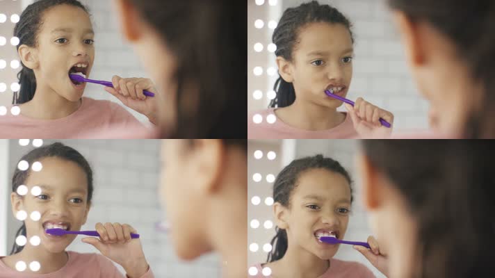 外国小姑娘面对镜子刷牙 