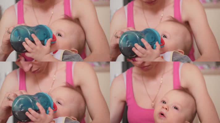 妈妈给婴儿喝水 婴儿用品 水壶