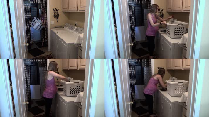 准妈妈在洗衣房使用洗衣机洗衣服