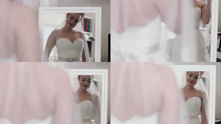 新娘面对镜子试穿婚纱 整理婚纱