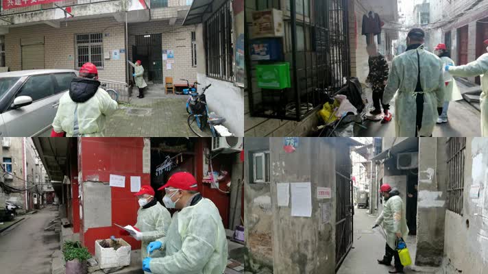 武汉志愿者走街串巷贴防疫告语及消毒