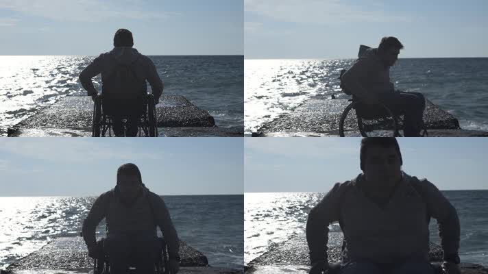 坐轮椅男子面对大海 