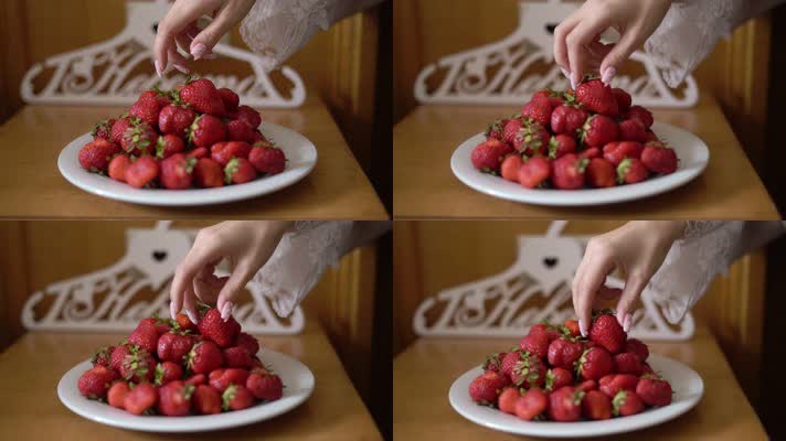 实拍用手拿草莓水果特写镜头