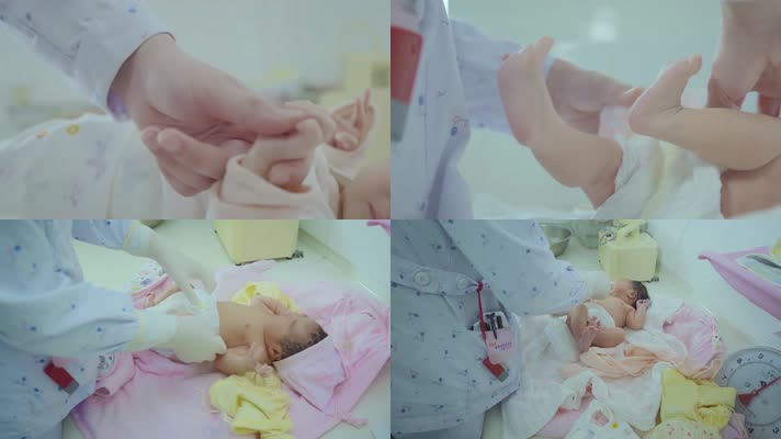 婴儿手脚特写护士给婴儿洗澡穿衣