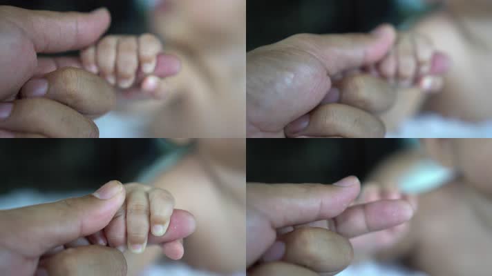 婴儿牵妈妈的手，新生儿出生