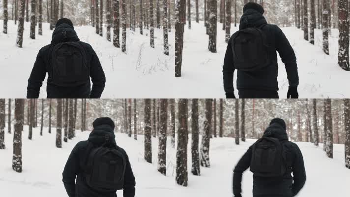 男人雪地行走背影