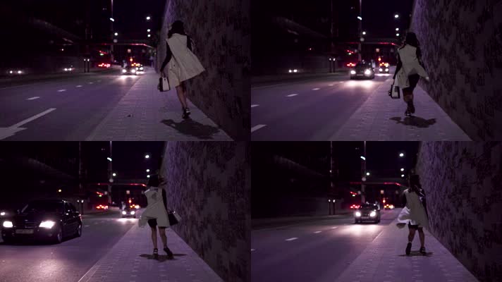 女人晚上街边行走