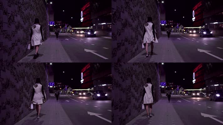 女人晚上街边行走