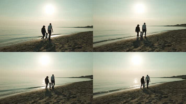 一家人牵手，海边散步