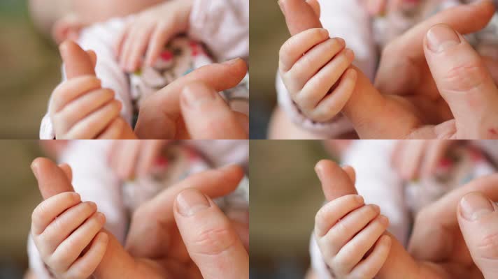 婴儿牵妈妈的手，新生儿出生