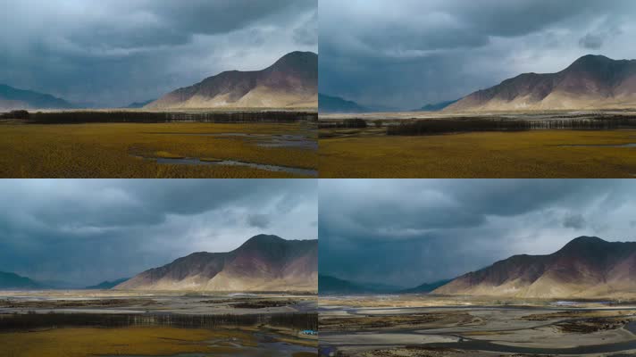 4k西藏风光视频高原乌云下高山河谷草地