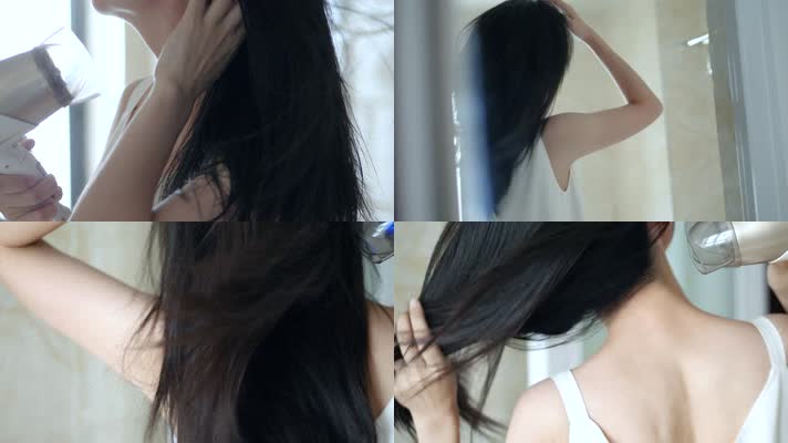 早晨女孩在浴室吹头发背影