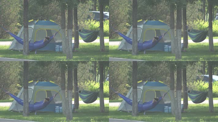 公园绿地树林中帐篷吊床休憩的游人