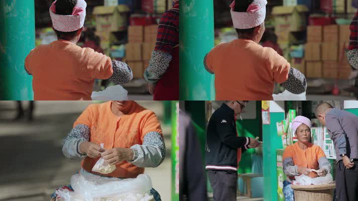 云南德宏芒市街头卖麦芽糖的傣族妇女