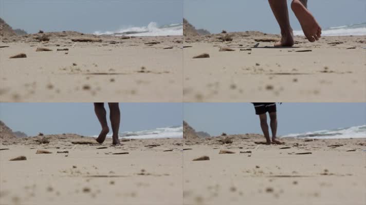 男人赤脚走在海边沙滩