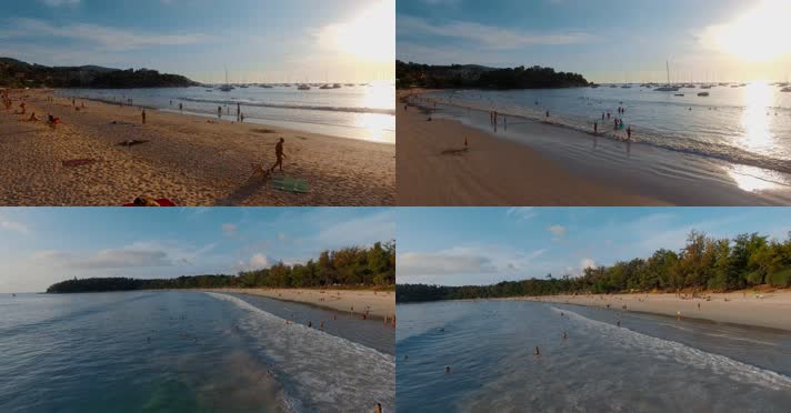 海岸沙滩视频夕阳下大海边金色沙滩上游客