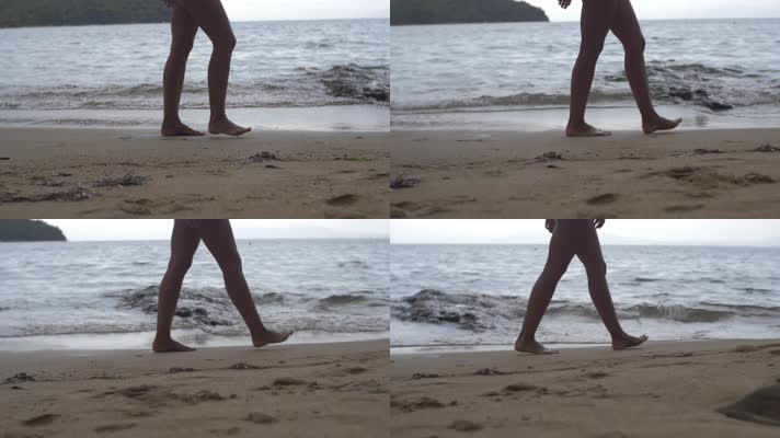 女人在沙滩上行走