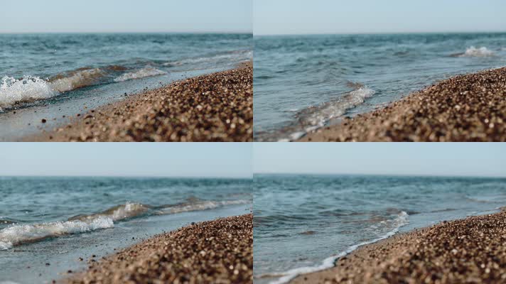 轻柔的海浪拍打海岸砂石的特写
