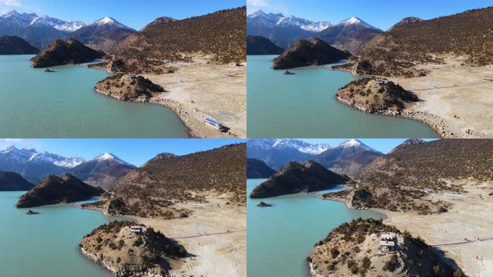 航拍西藏318国道旁的雪山下的碧绿色然乌湖