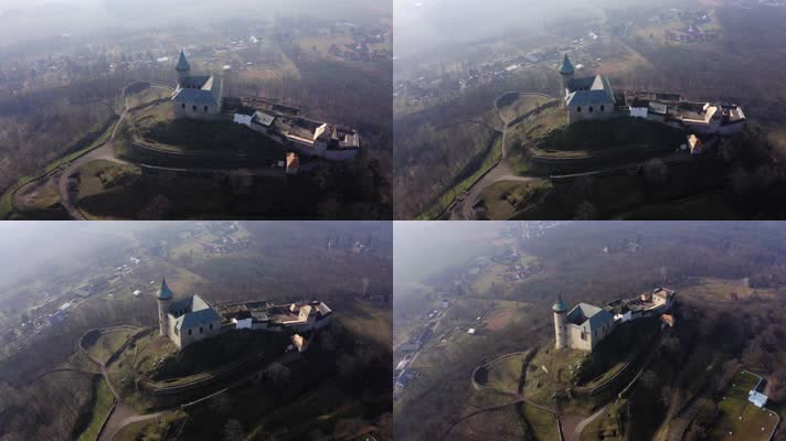 无人机在岩石上绕着古堡塔飞行