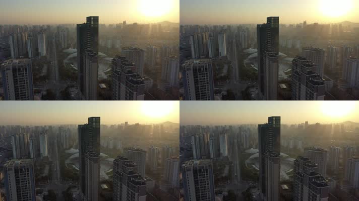 航拍晨光中的城市高层楼群