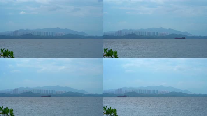 游轮游船驶过大海海水海面对岸是香港元朗