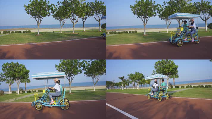 厦门彩虹沙滩滨海公园骑行的男女