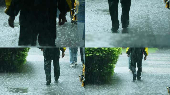 在暴雨中行走的人们脚步匆匆