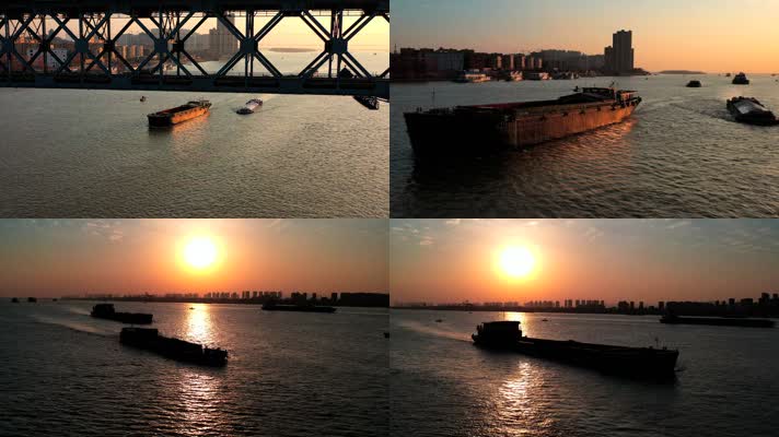 航拍南京长江夕阳下的江面货船来往穿梭