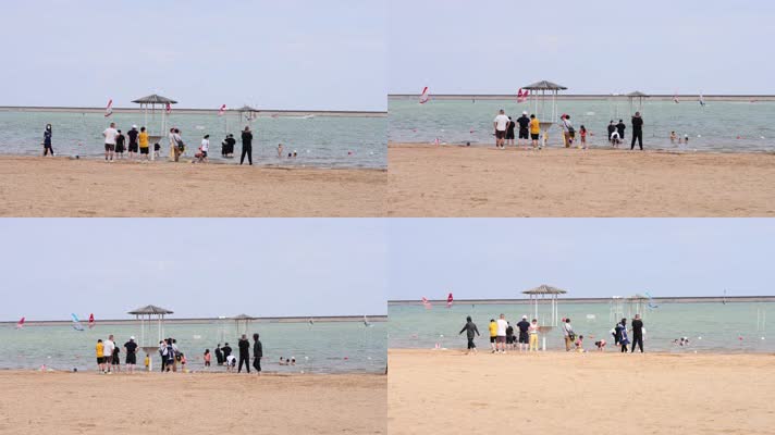 疫情之后沙滩玩耍的人们海浪帆船冲浪