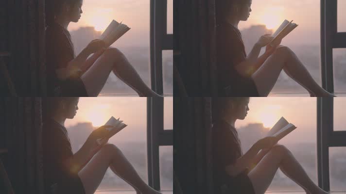 女孩在夕阳下的落地窗边看书翻书4k视频