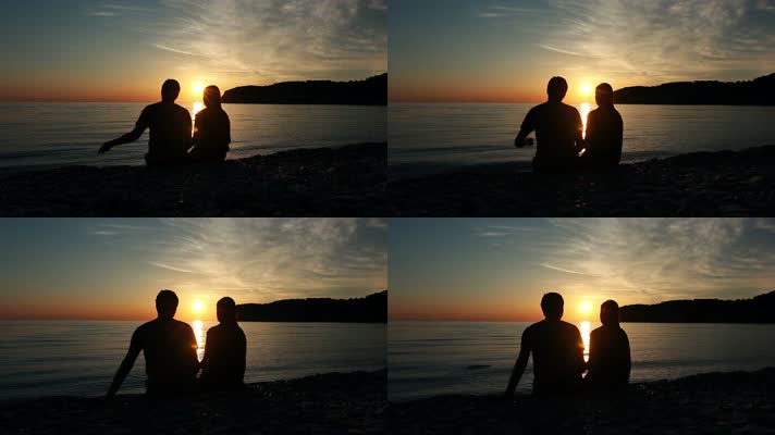 日落时分坐在海边的恋人素材