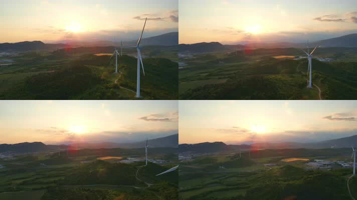 日落时山坡上航拍风力涡轮机发电清洁能源