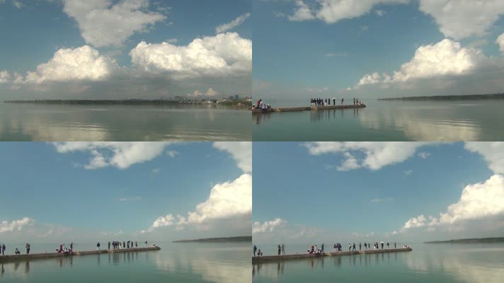滇池海晏码头蓝天白云倒影在平静水平面上
