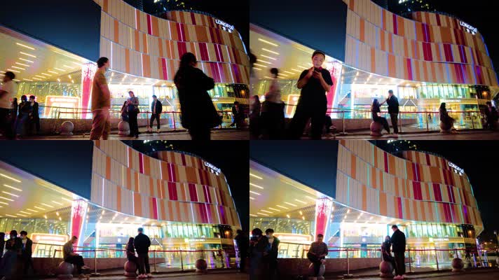 城市夜晚广场休闲散步的年轻人人流延时摄影