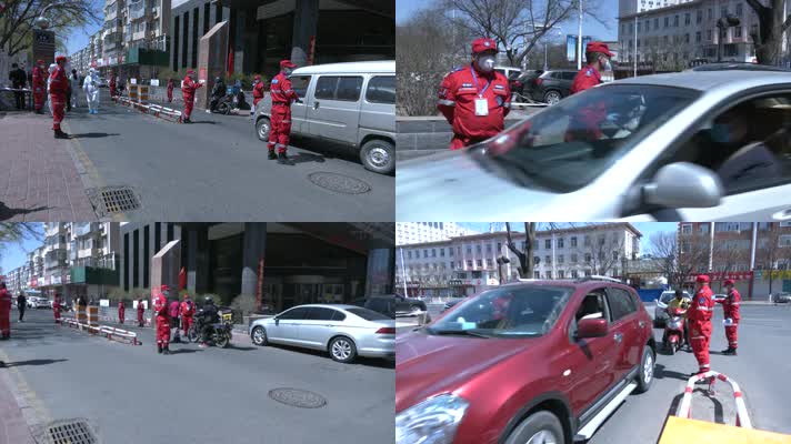 穿红色衣服的志愿者服务队协助社区查验车辆