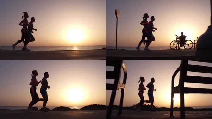 夕阳下情侣在海边跑步