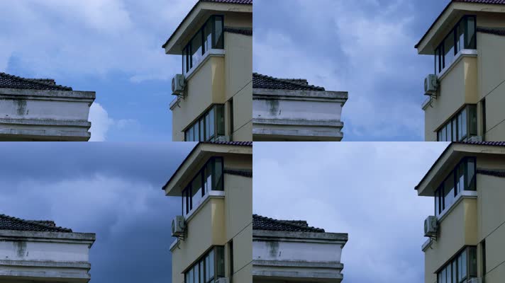 现代城市建筑屋顶上空的局部蓝天延时