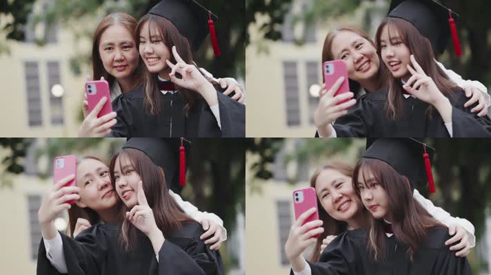 母亲和毕业的女儿在大学校园用智能手机自拍