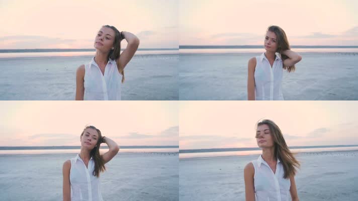 日落时分，海滩上年轻迷人的女孩、美女 