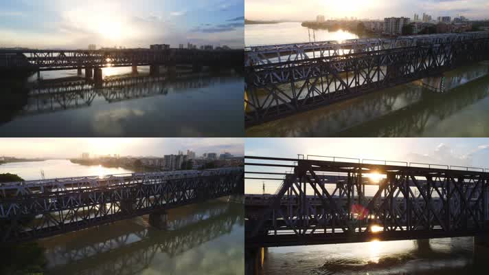 4K航拍夕阳下高铁和谐号驶过江上大桥