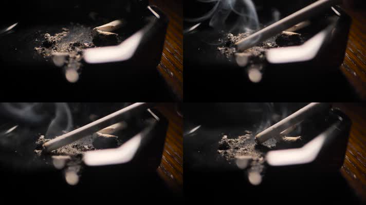 烟灰缸里的香烟在燃烧冒烟