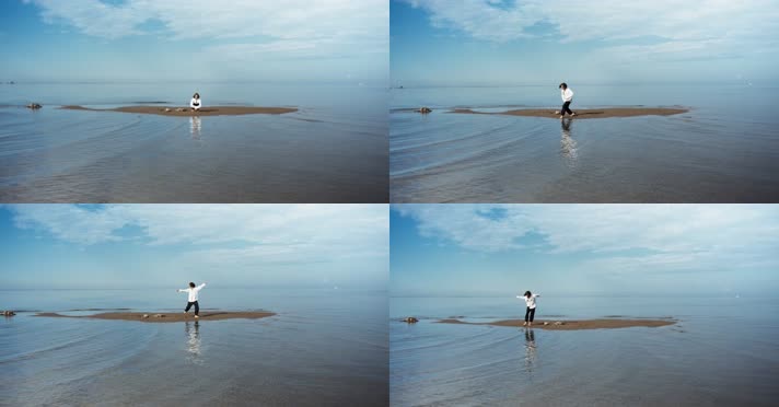一个人站在水中央的高地上孤独伤感大海
