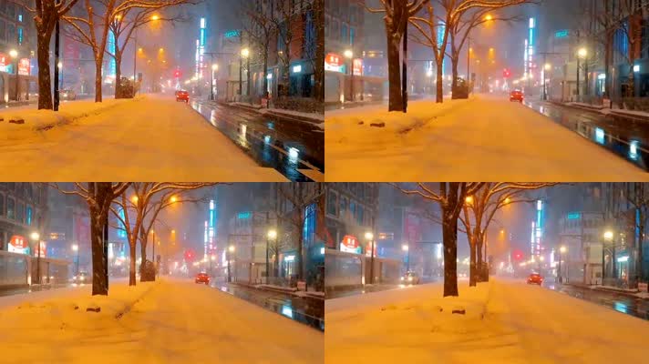 下雪中的夜晚城市街道